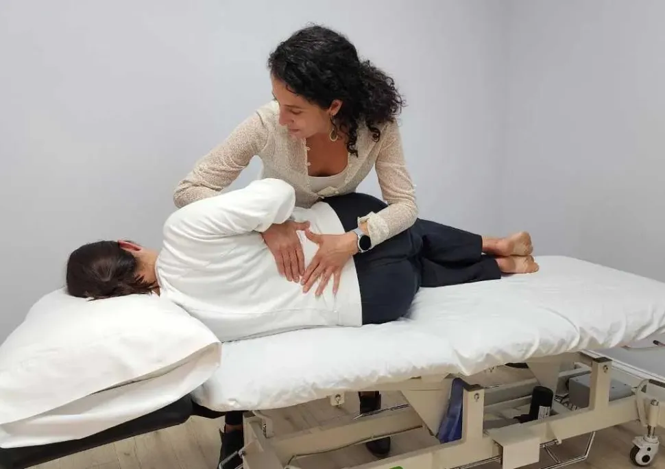 A Universus physical therapist providing hands-on treatment to a patient